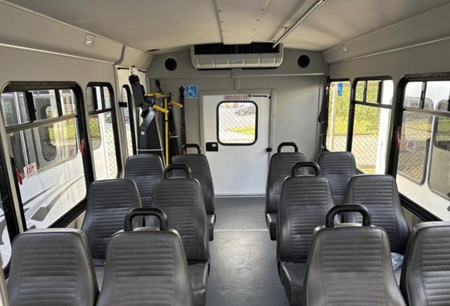 14-passenger shuttle bus interior with rear lift and flip seats