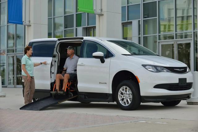 Side-entry wheelchair accessible minivan with ramp deployed