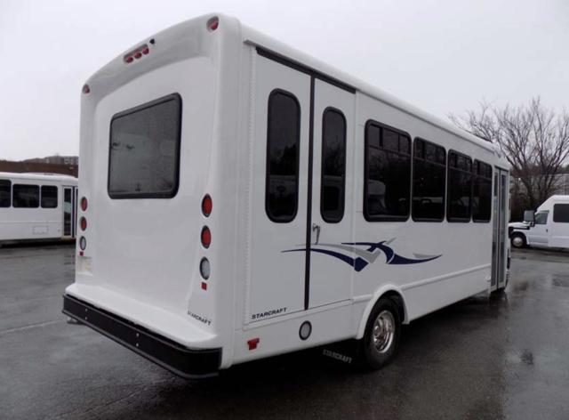 Rear three-quarter view of a StarCraft cutaway shuttle bus with rear lift door